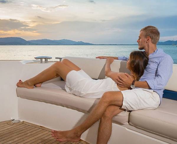 Couple watching the sunset on yacht Abama Hotels